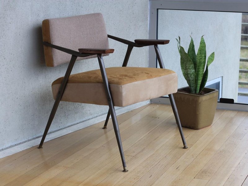 A Fancy Chair with Laminate Flooring that Looks Like a Realistic Wooden Floor